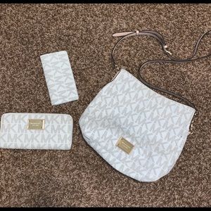 Michael Kors purse wallet and check book.